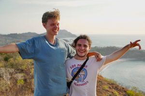 Dreamsea Costa Rica Surf Camp | backpacking, travel, hostel, surf, and yoga camp | Blog | picture of 2 friends in tamarindo, costa rica hiking cliffs beach side