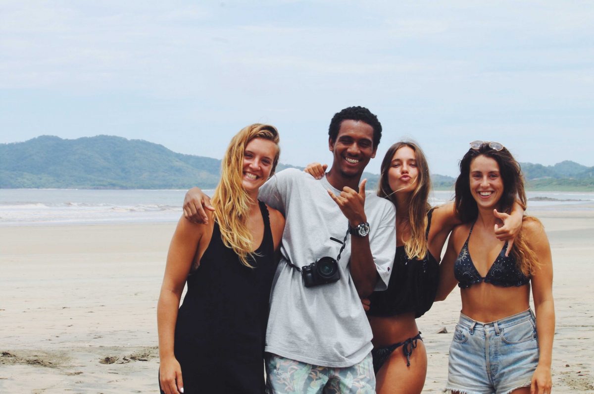 Dreamsea Costa Rica Surf Camp | backpacking, travel, hostel, surf, and yoga camp | Blog | picture of man and 3 girls on a beach