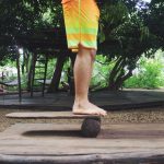 Dreamsea Costa Rica Surf Camp | backpacking, travel, hostel, surf, and yoga camp | Blog | picture of man on a balance board